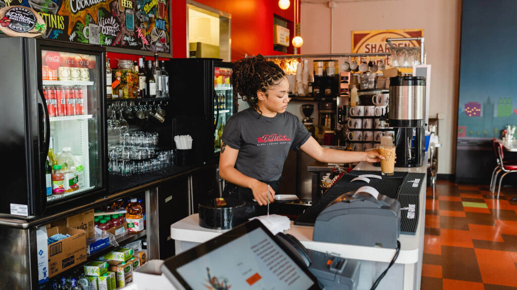 Barista making iced coffee