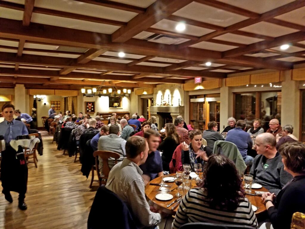 people enjoying dinner at a restaurant