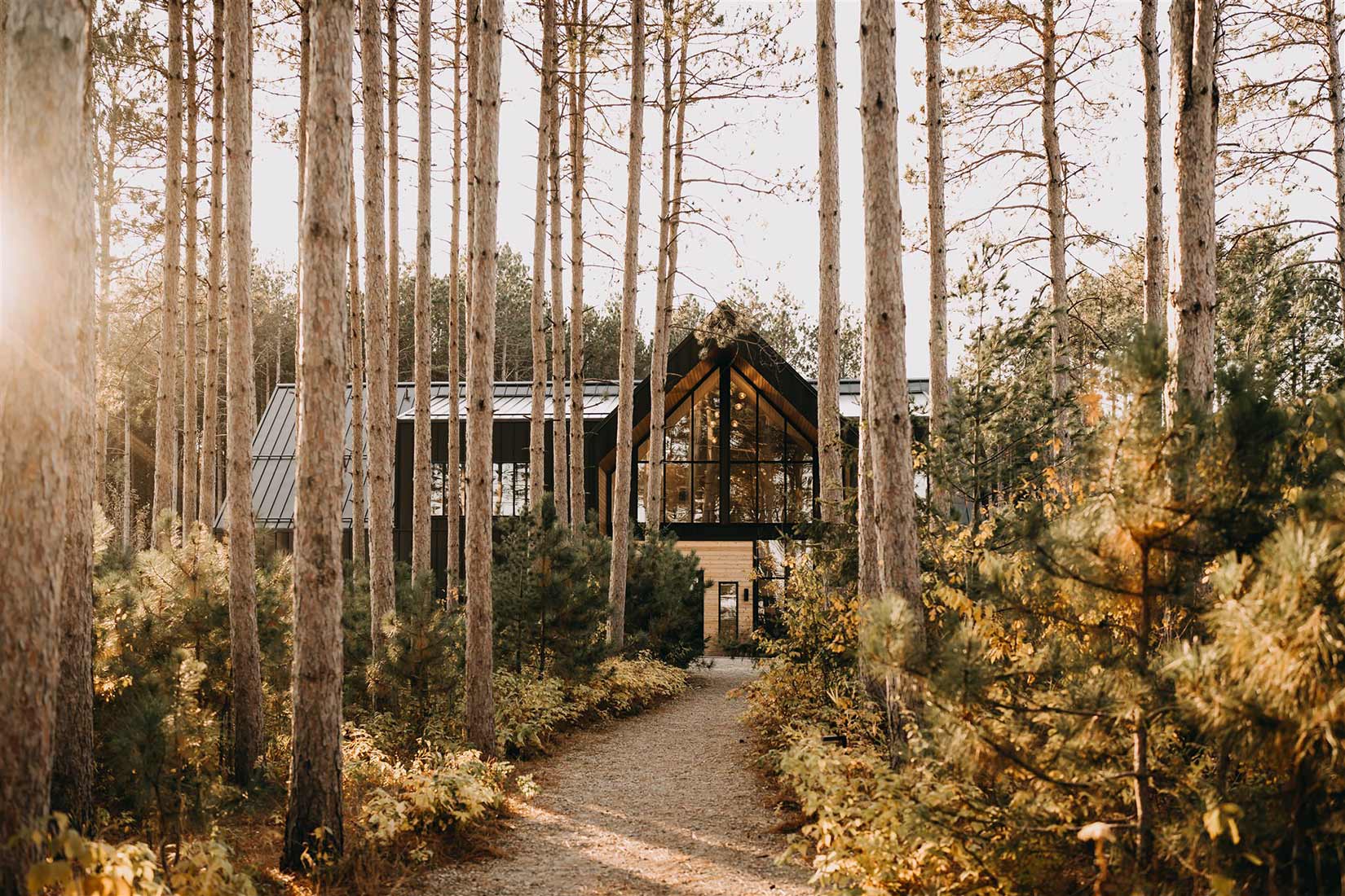 Pinewood Wedding & Event center venue building in the trees with a path