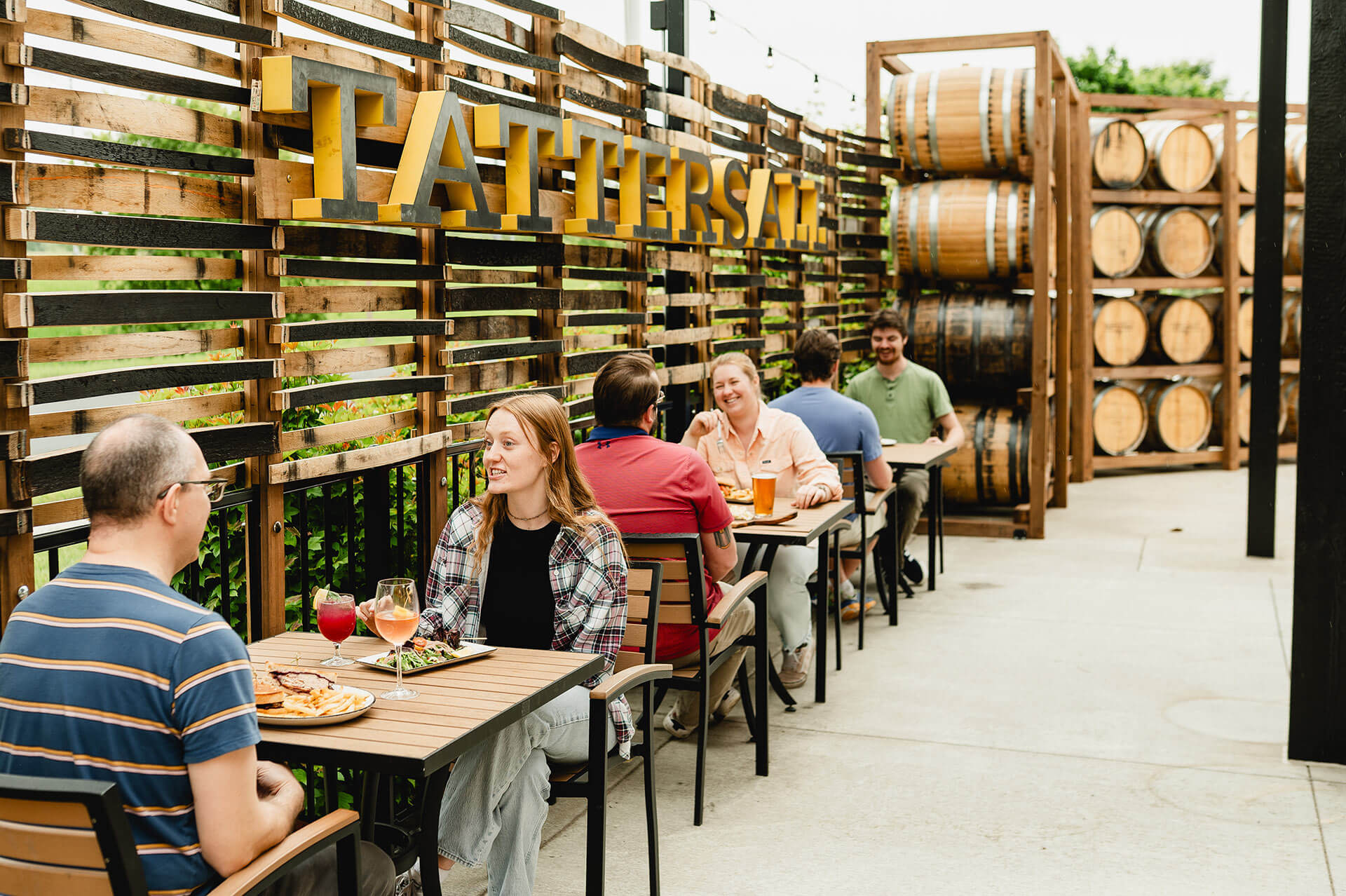 people sitting at tables enjoying drinks